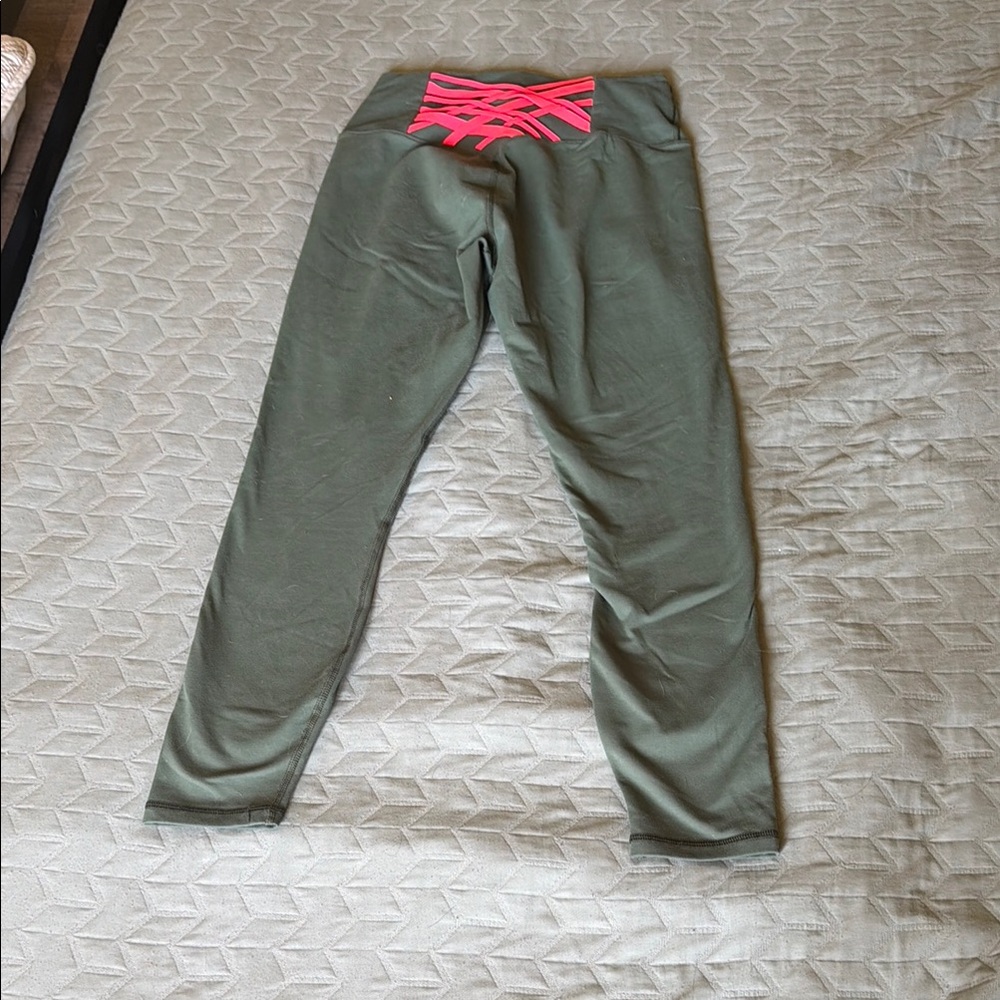 Fabletics Powerhold Green Leggings with Pink Crisscross Waistband